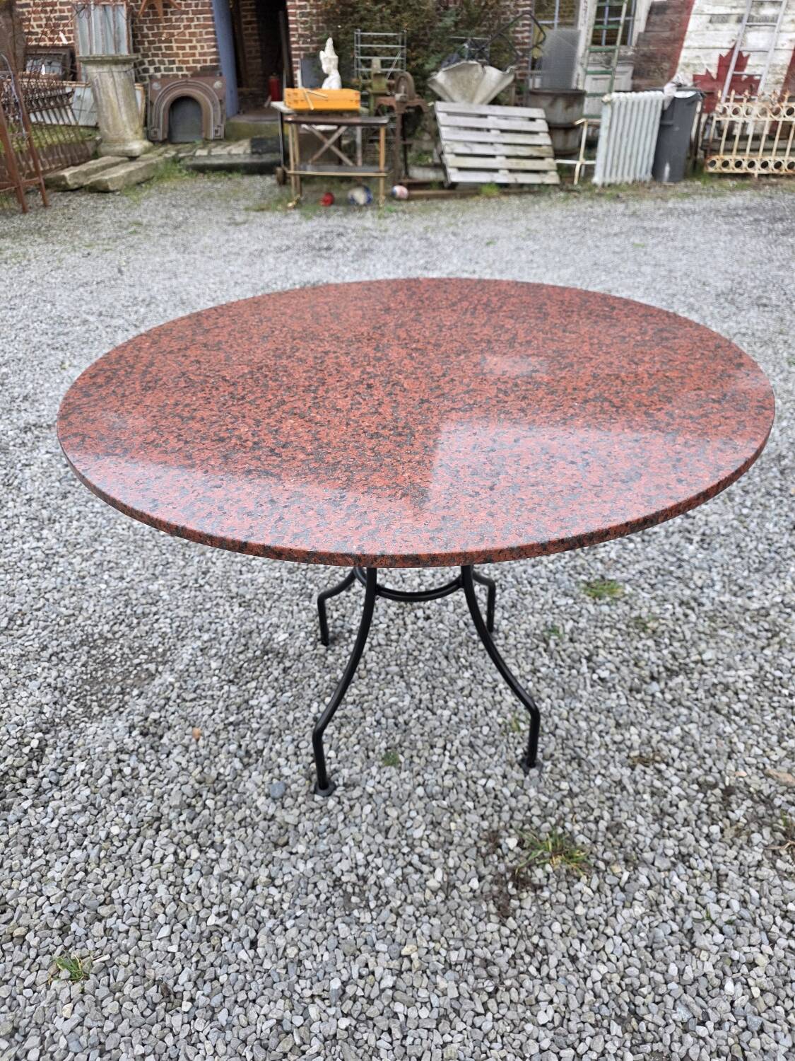 Round marble table with wrought iron base from the mid-20th century.