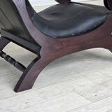 1970s, vintage armchair with footstool, black furniture leather.