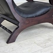 1970s, vintage armchair with footstool, black furniture leather.