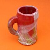 Traditional ceramic mug with a marbled glaze effect.