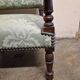 Antique Louis XIV style armchair in moulded wood and damask-style fabric.