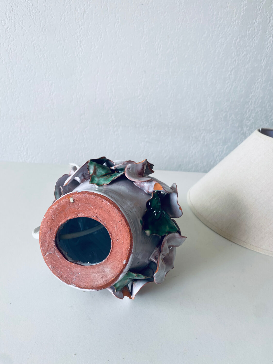 Terracotta lamp flower in relief