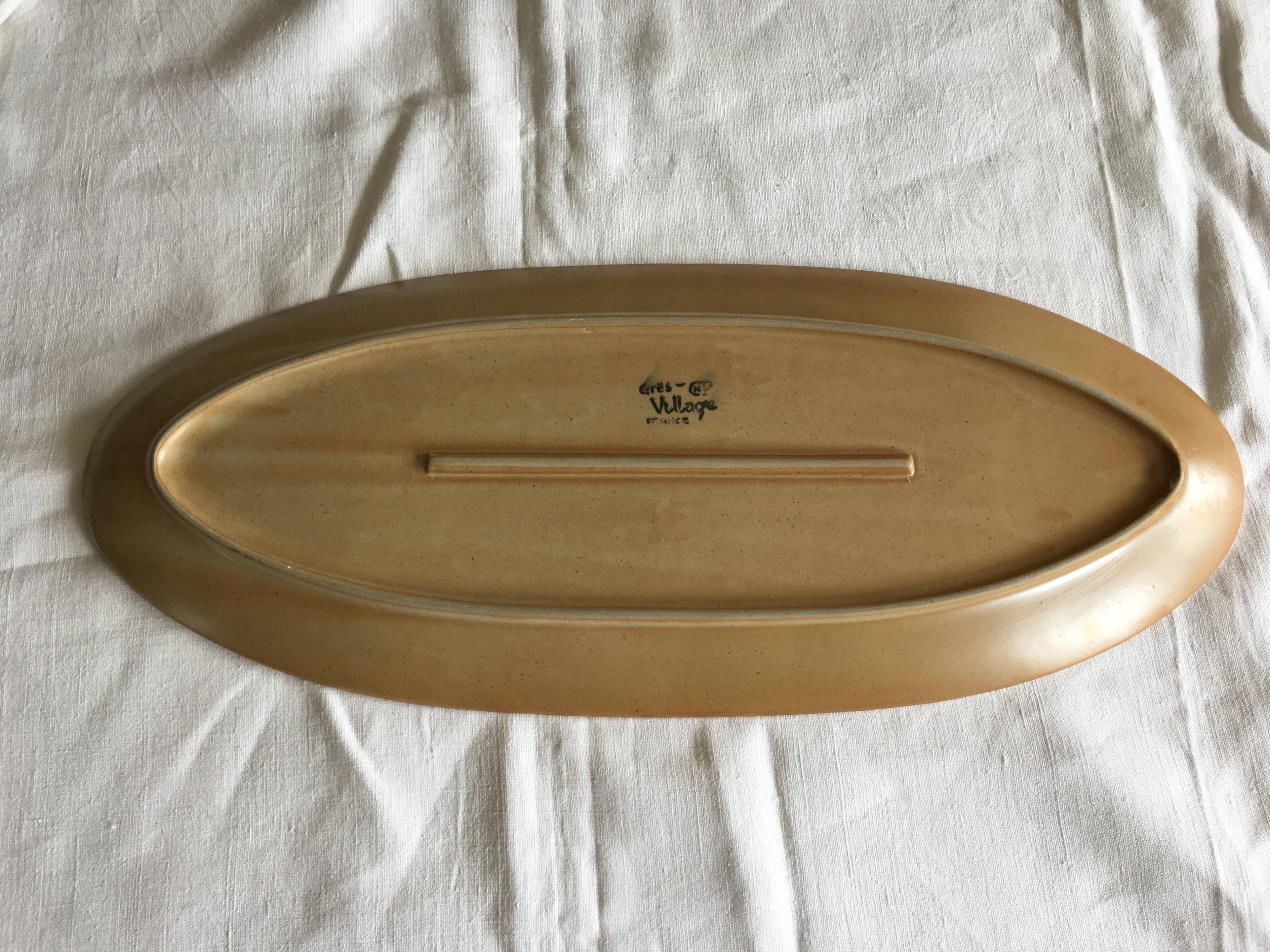 Very large fish dish stamped “Grès CNP Village France”