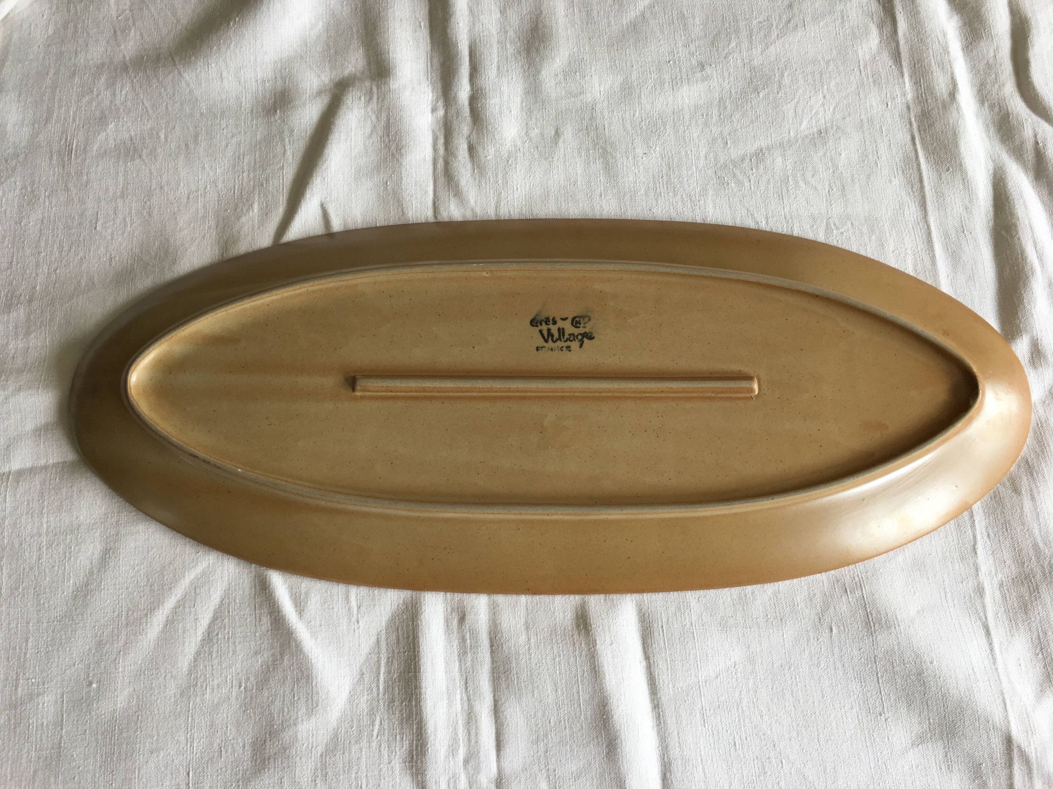 Very large fish dish stamped “Grès CNP Village France”