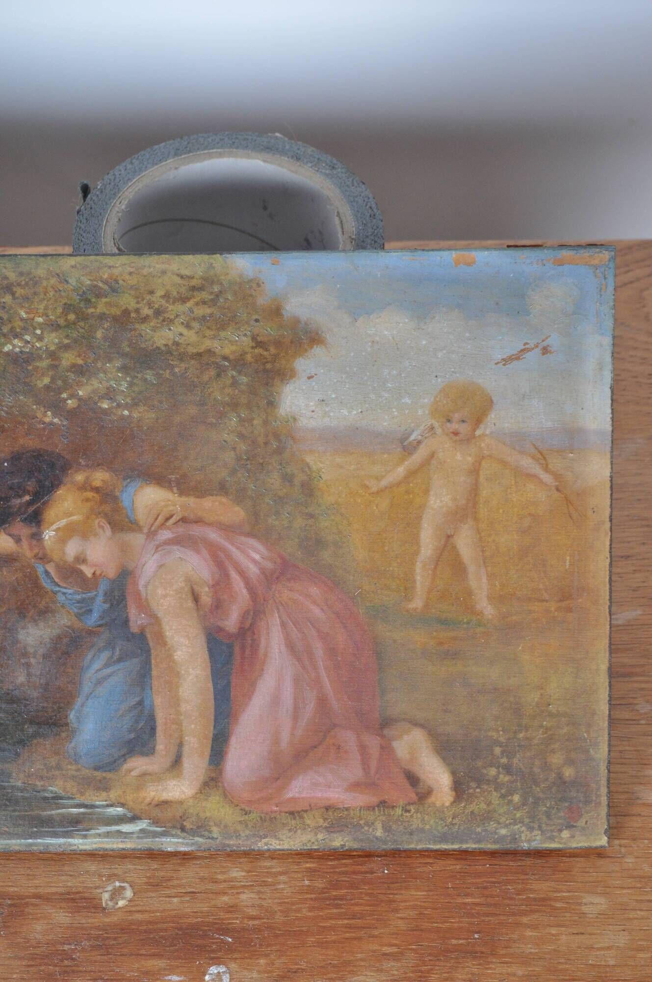 Painting on wood "Cupid and a couple at the fountain".