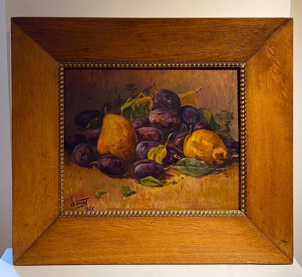 Still life with quetsches and pears signed and dated 1935