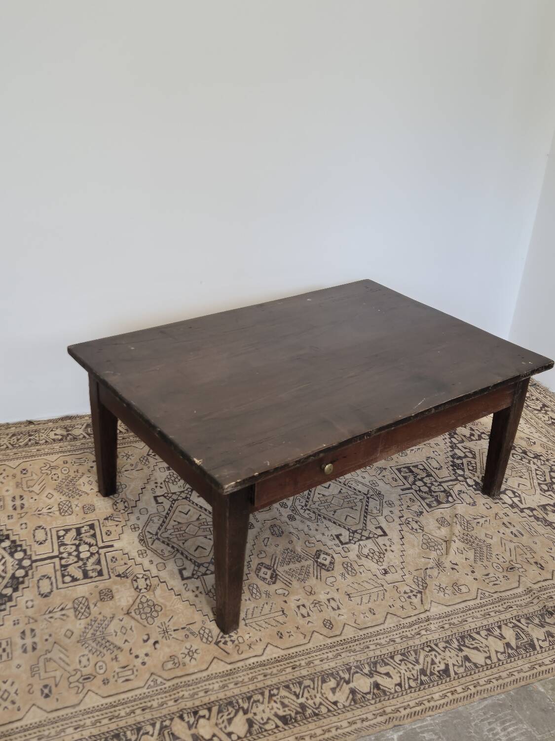 Rustic farmhouse coffee table from the 1900s with two drawers.