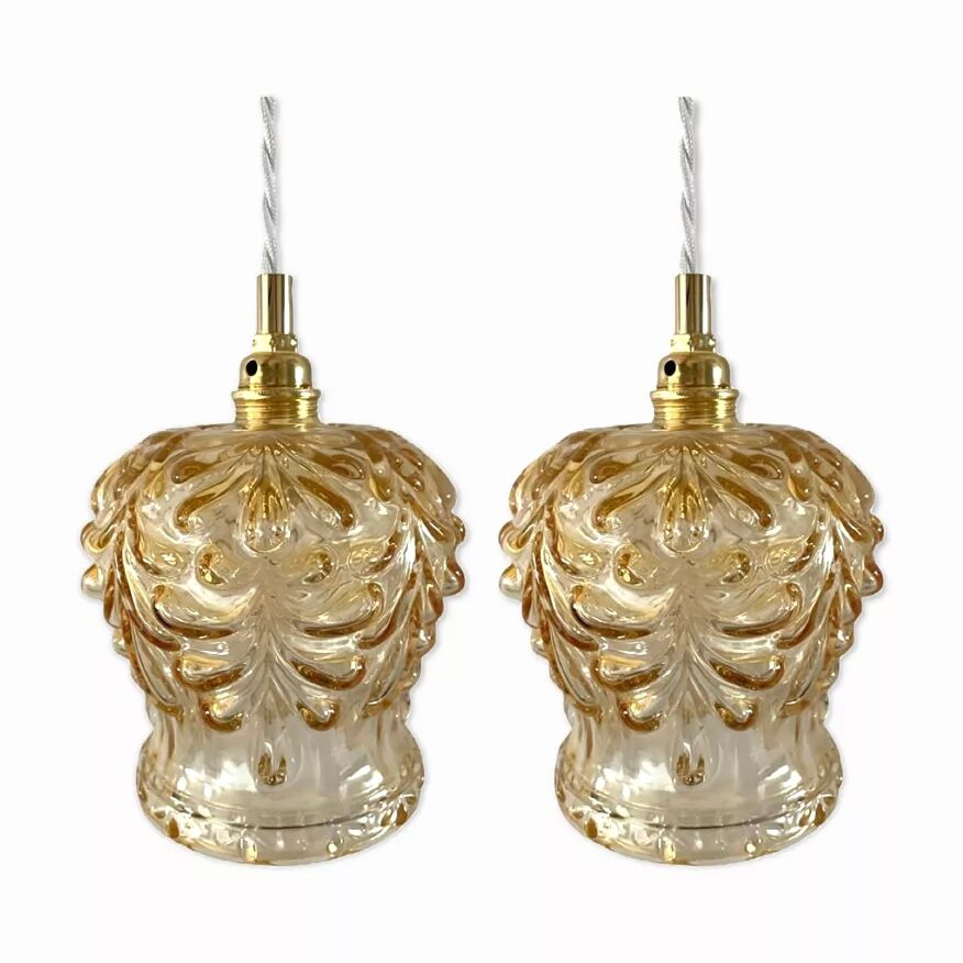 Set of two suspensions in gilded chiseled glass