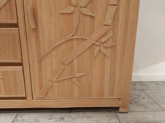 Vintage wicker sideboard with flowers