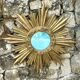 Large sun mirror in carved gilded wood.