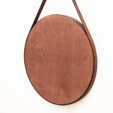 Round mirror in walnut