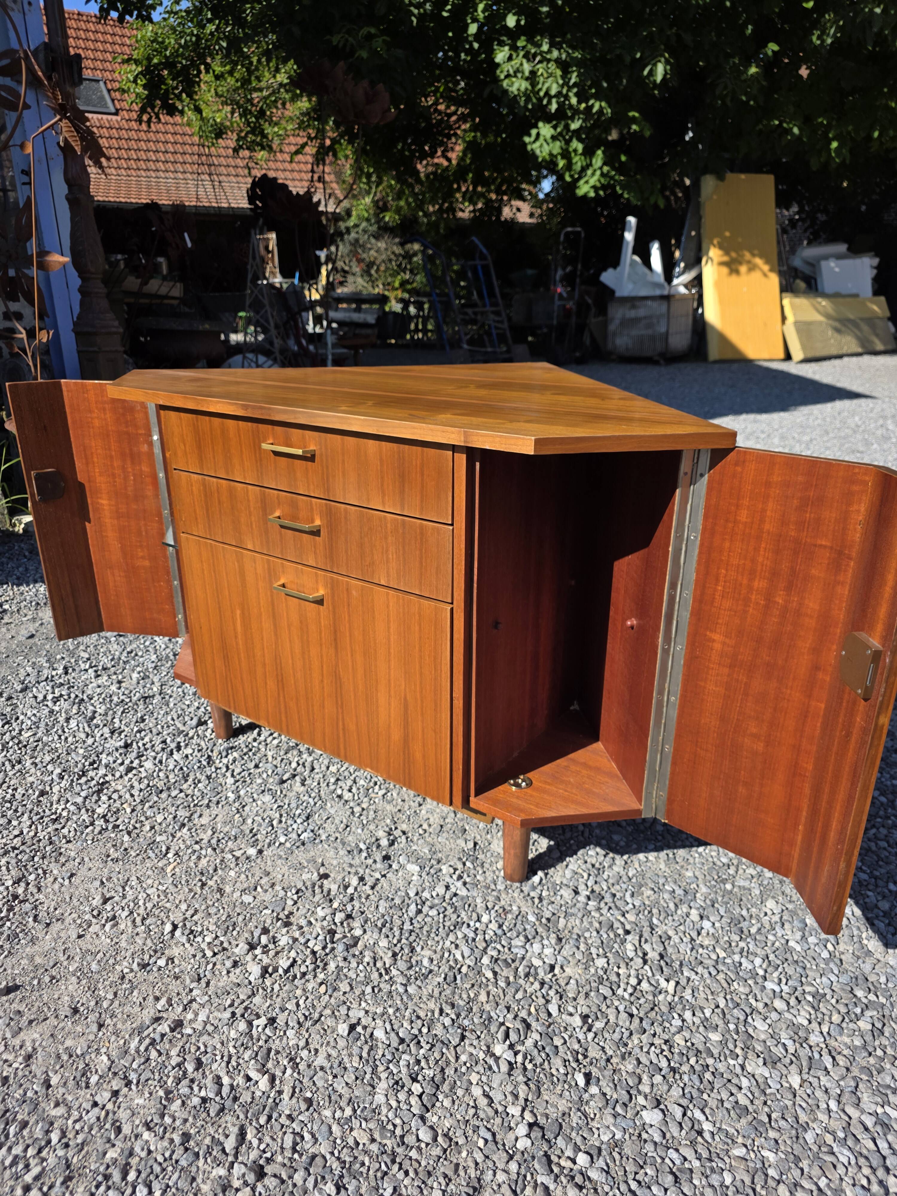 Scandinavian corner unit in teak from the 1960s.