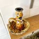Enamelled ceramic candle holder