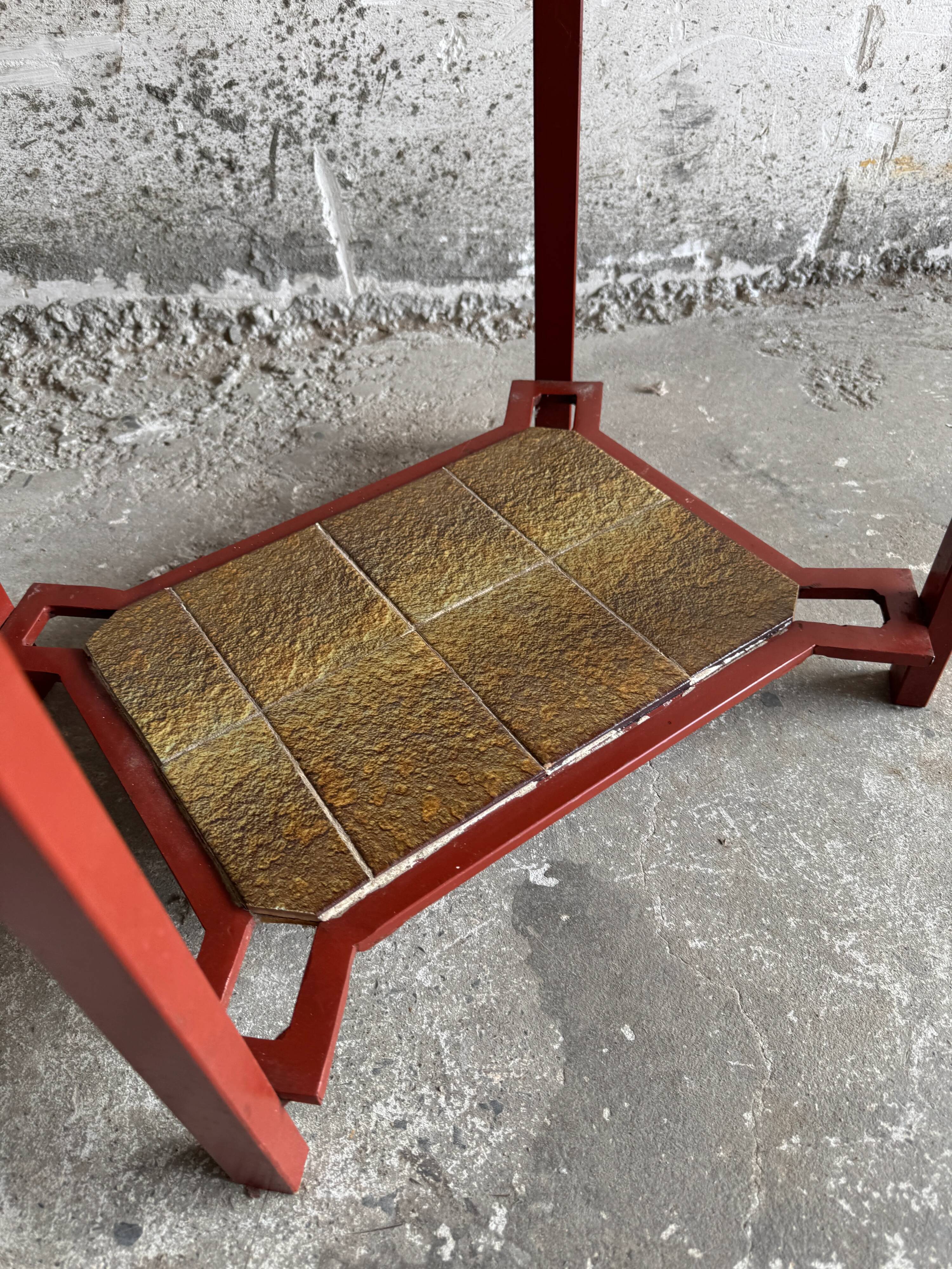 Vintage terracotta-red metal side table with glazed brown-green ceramic tile surfaces