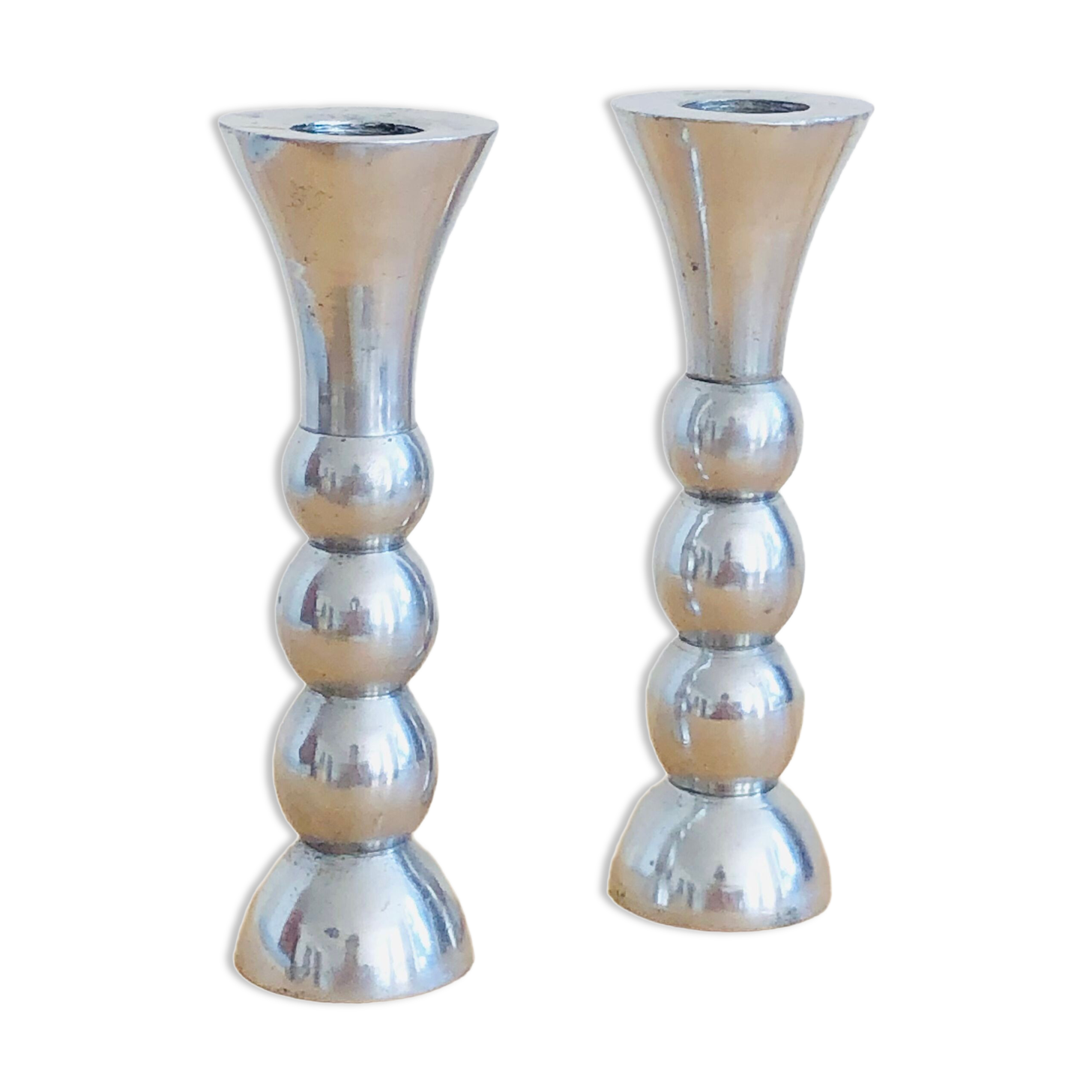 Pair of vintage cast aluminum candle holders