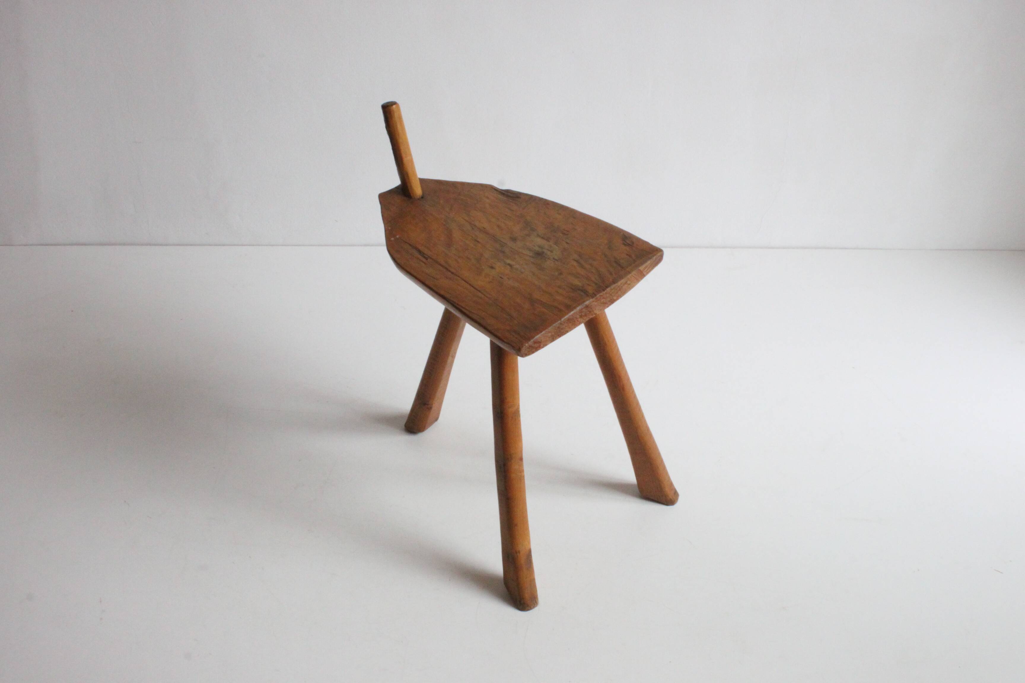 Brutalist tripod stool in carved wood, 1950s
