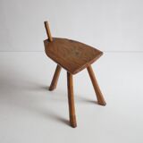 Brutalist tripod stool in carved wood, 1950s
