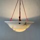 Art Deco suspended lamp in white marble-effect glass, 1940s, Germany.