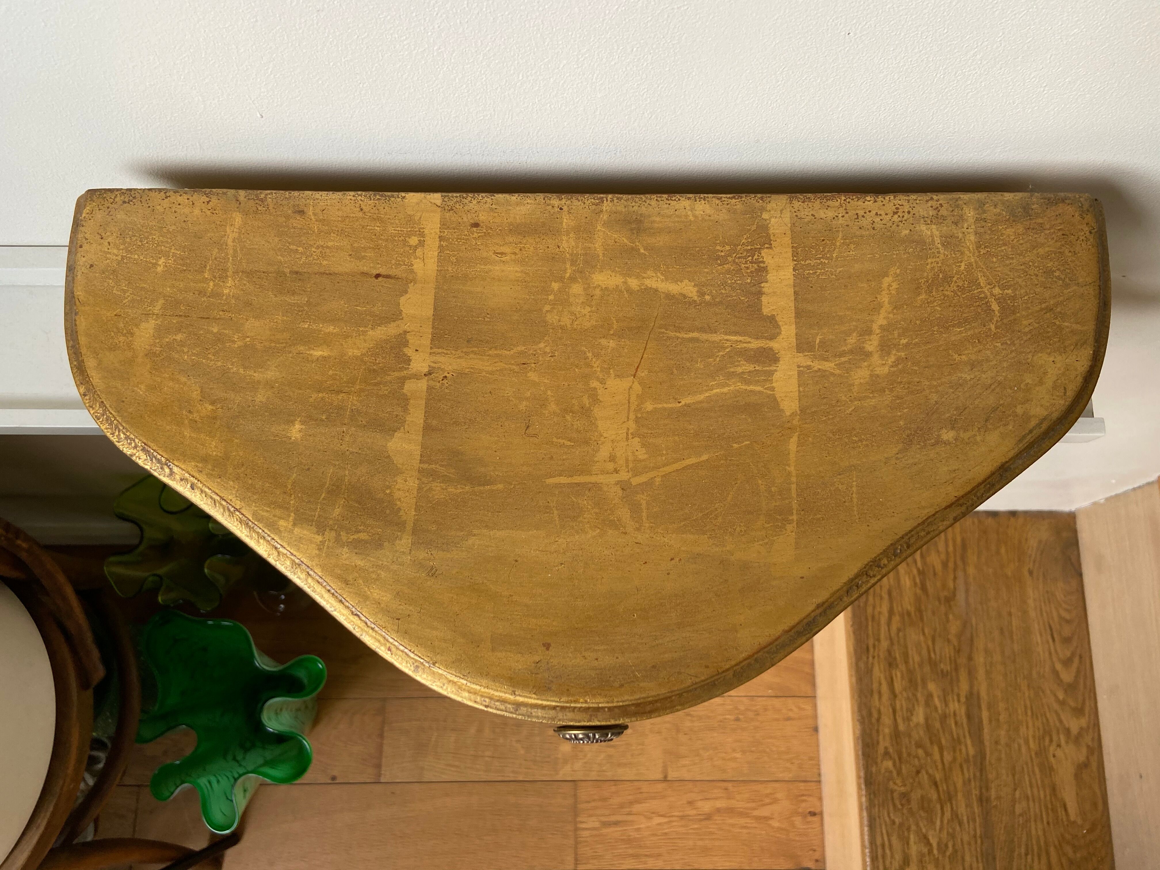 Gold wall shelf with drawer