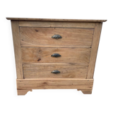 Raw wood chest of drawers with three drawers and shell handles.