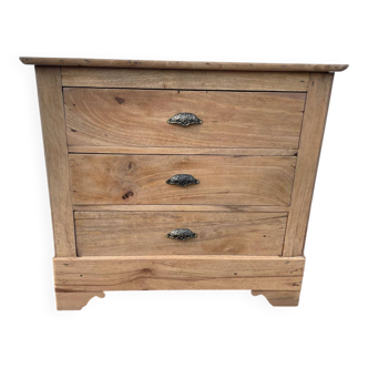 Raw wood chest of drawers with three drawers and shell handles.