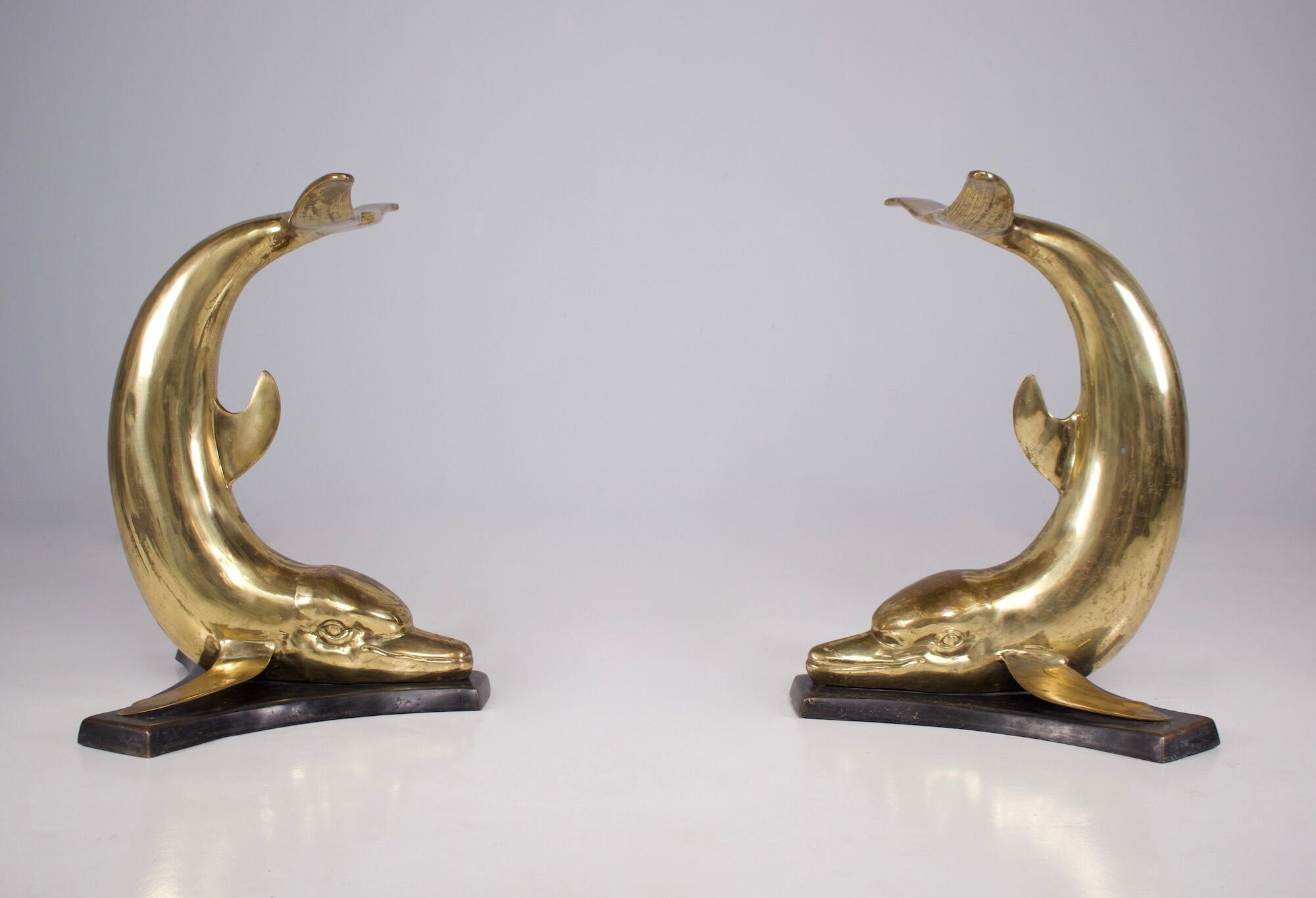 Solid brass dolphin console feet.