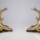 Solid brass dolphin console feet.