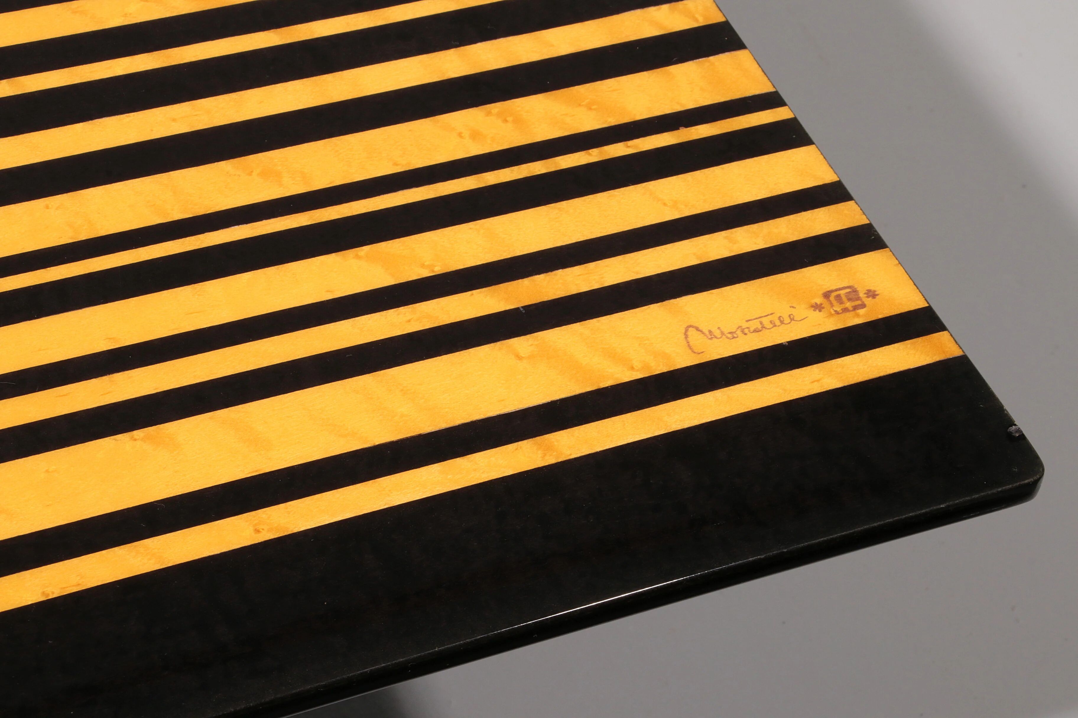 1980s Italian coffee table in black and yellow lacquered wood