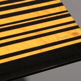1980s Italian coffee table in black and yellow lacquered wood