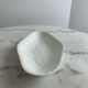 Oval white porcelain ramekin — raised floral pattern