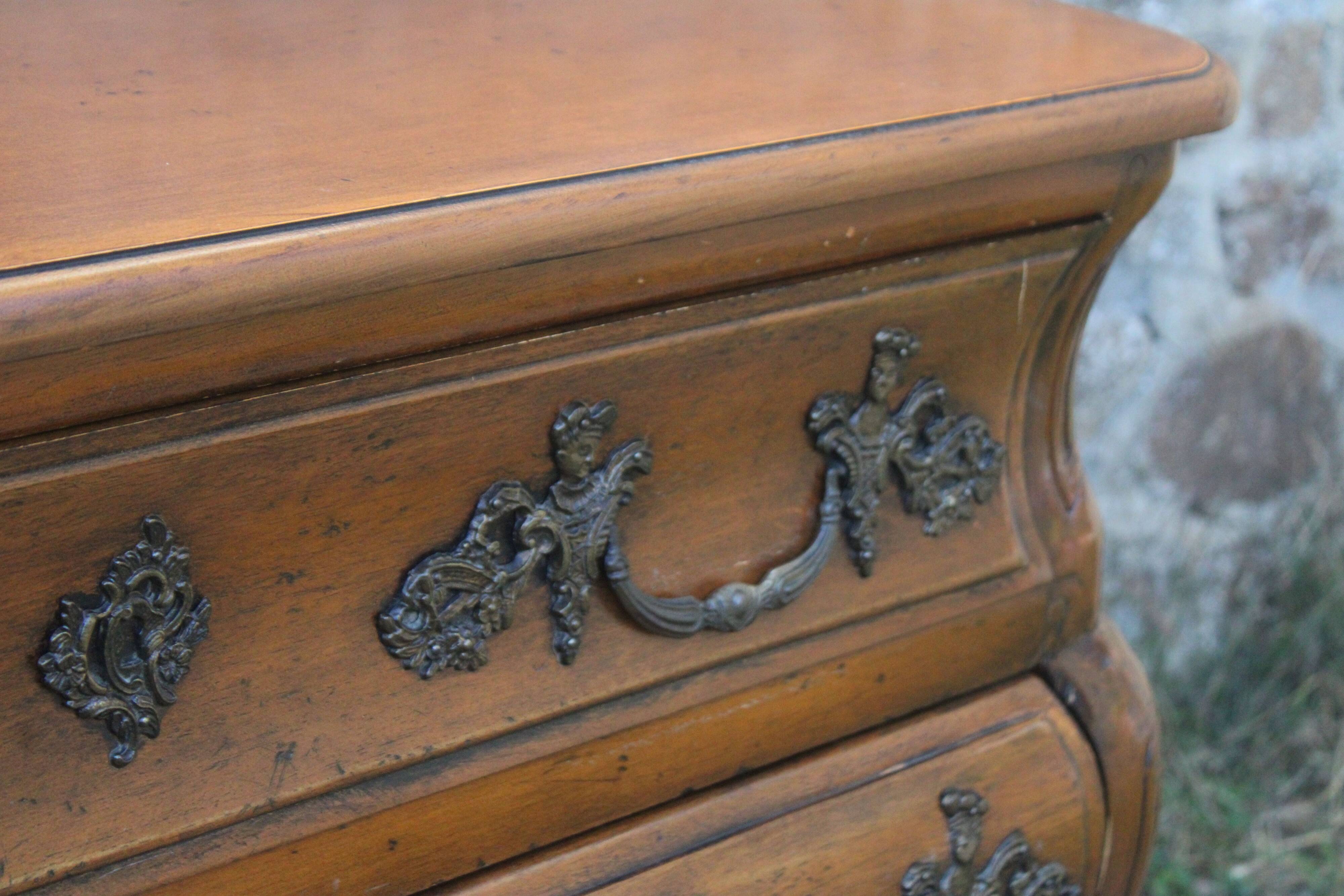 Curved Louis XV style chest of drawers known as a “tomb”