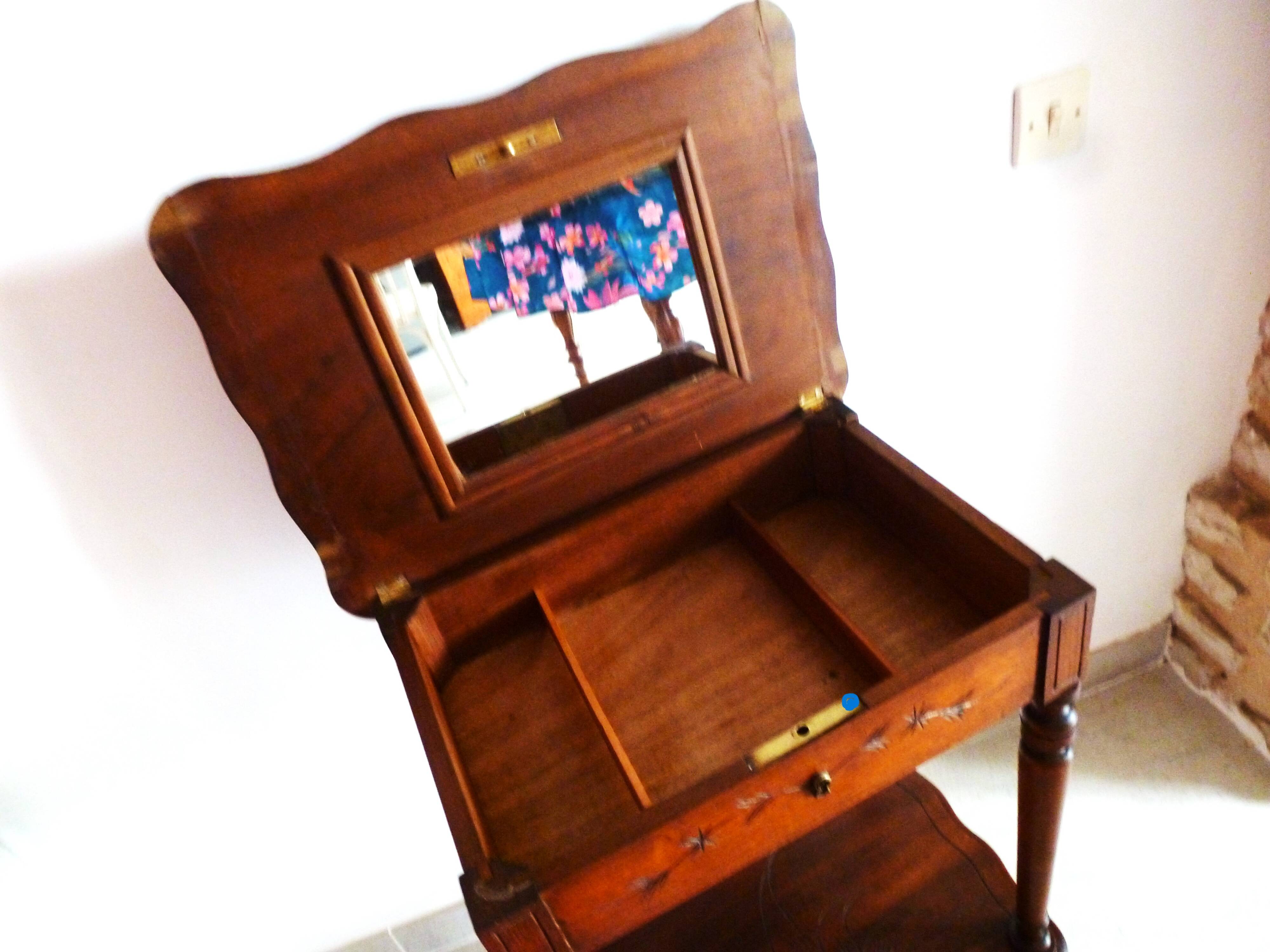 Vintage 1920s wooden dressing table with mirror and storage.