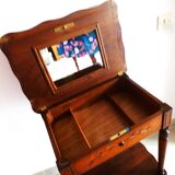 Vintage 1920s wooden dressing table with mirror and storage.