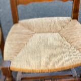 4 or 5 solid wood chairs with light oak straw and high backs