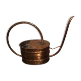 Old copper watering can