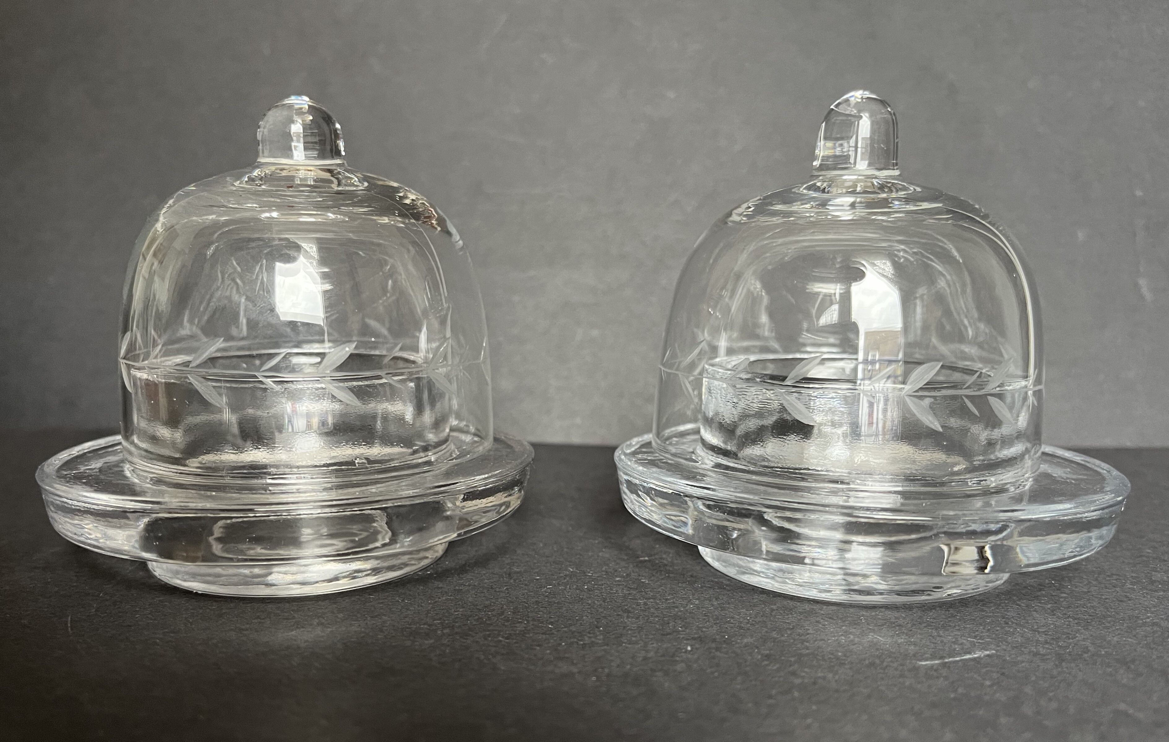 Pair of engraved glass butter dishes