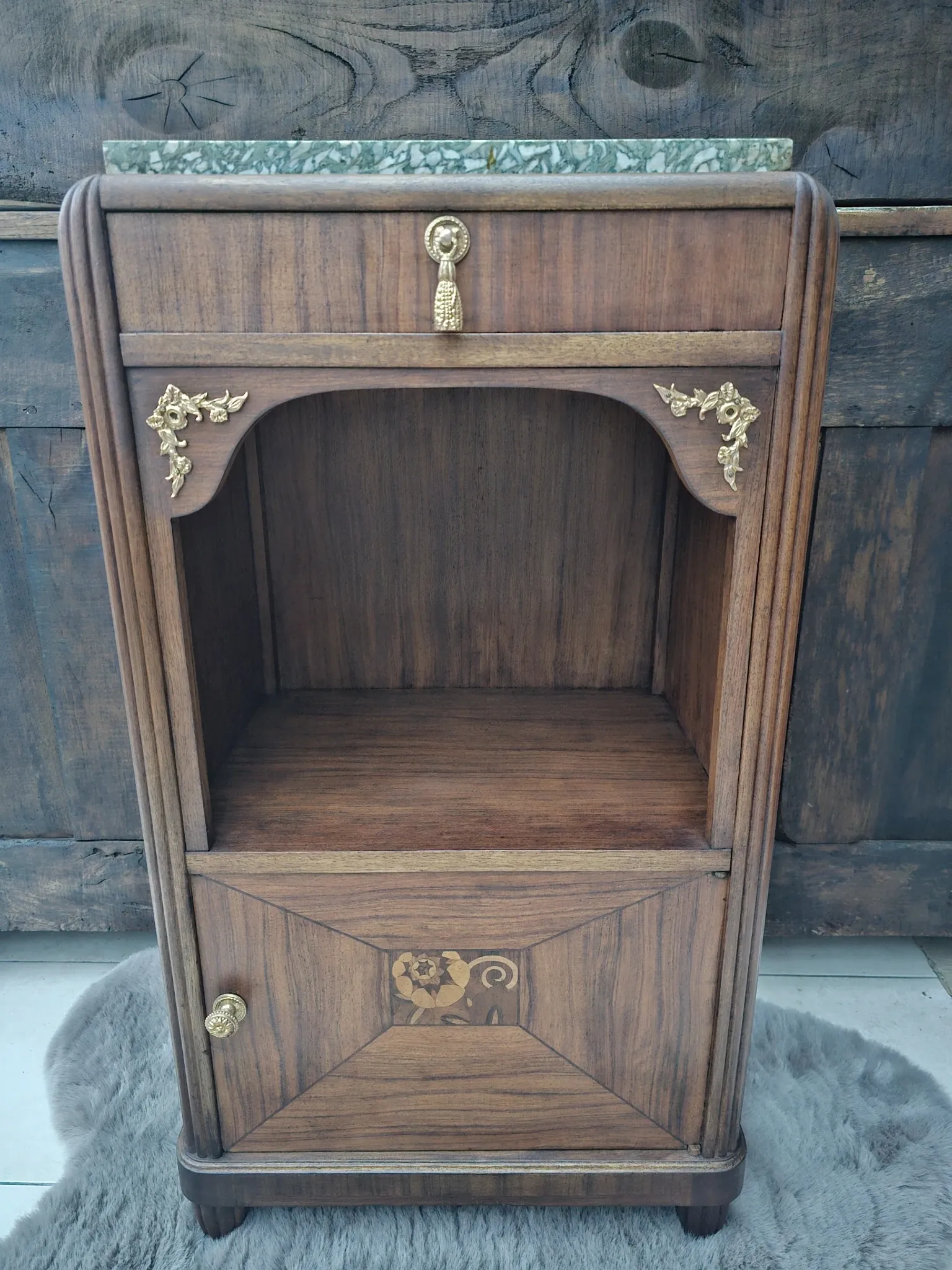 Art Deco bedside table with a green marble top.