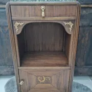 Art Deco bedside table with a green marble top.