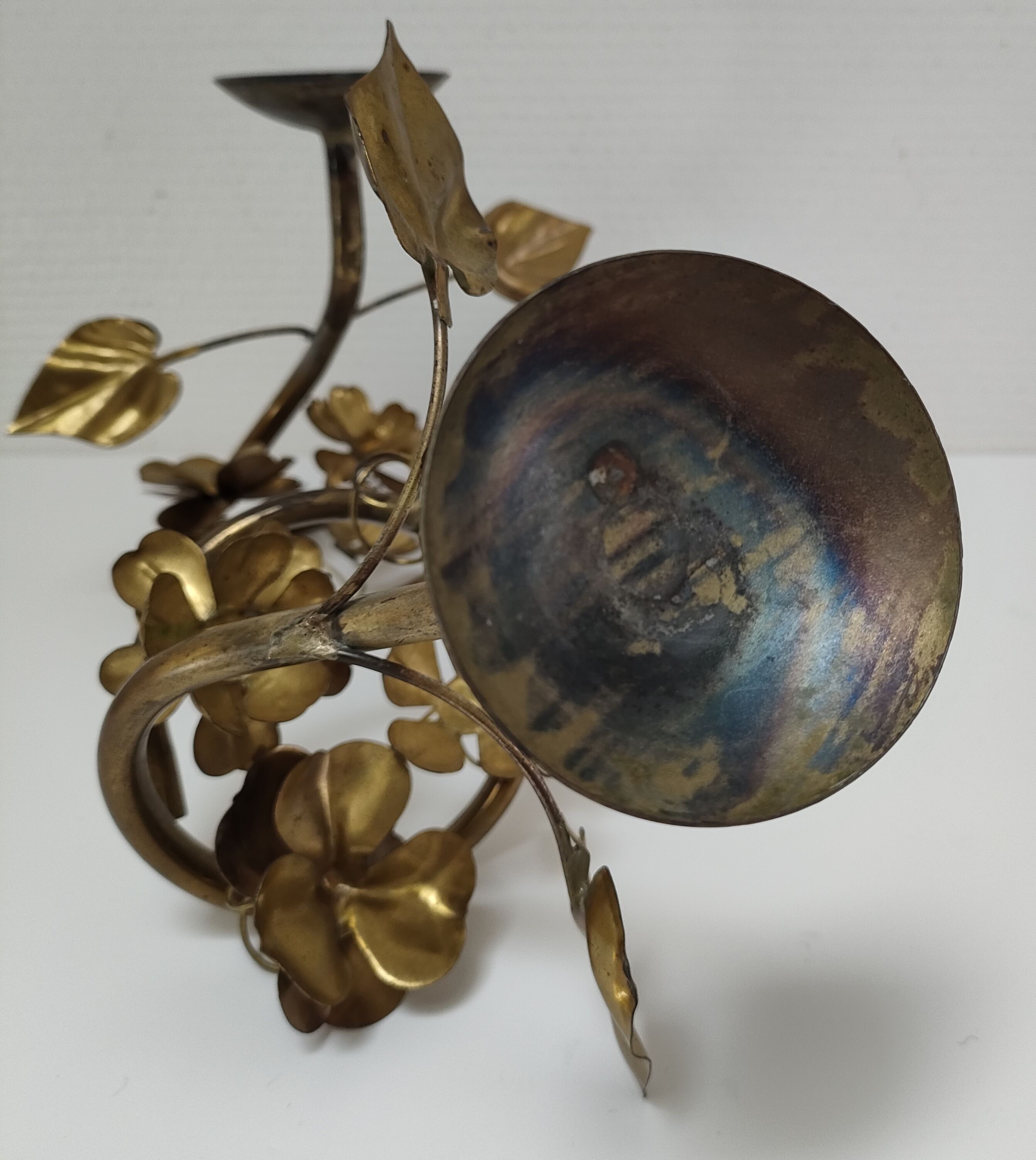 Pair of brass candle holders decorated with patinated metal flowers