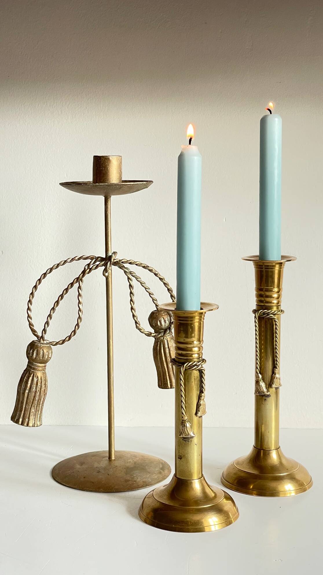 Trio of vintage knotted candlesticks brass