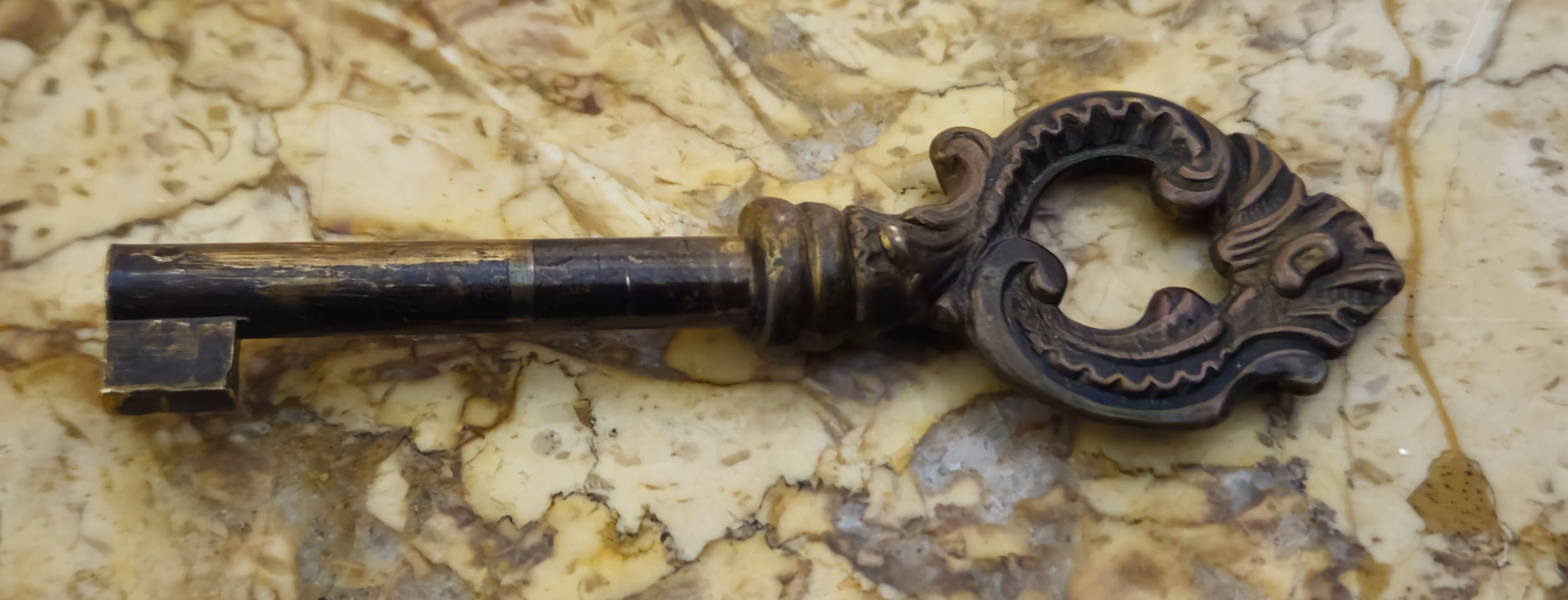 Curved Louis XV style commode with floral marquetry and marble top.