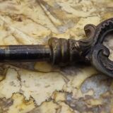 Curved Louis XV style commode with floral marquetry and marble top.