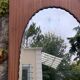 Miroir oval biseauté sur porte art déco Acajou 79x162