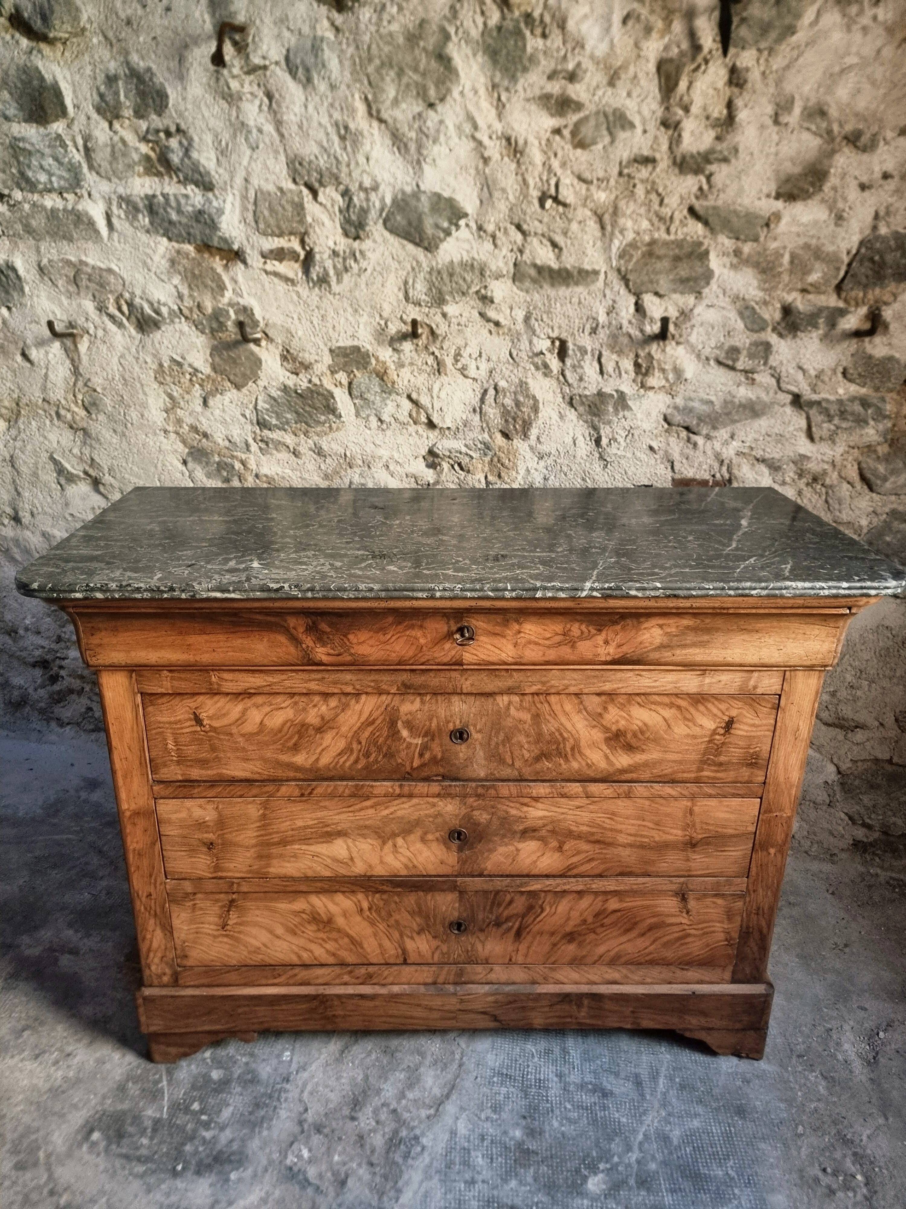 French antique walnut commode with a dark grey marble top, circa 1830–1860.