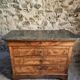 French antique walnut commode with a dark grey marble top, circa 1830–1860.