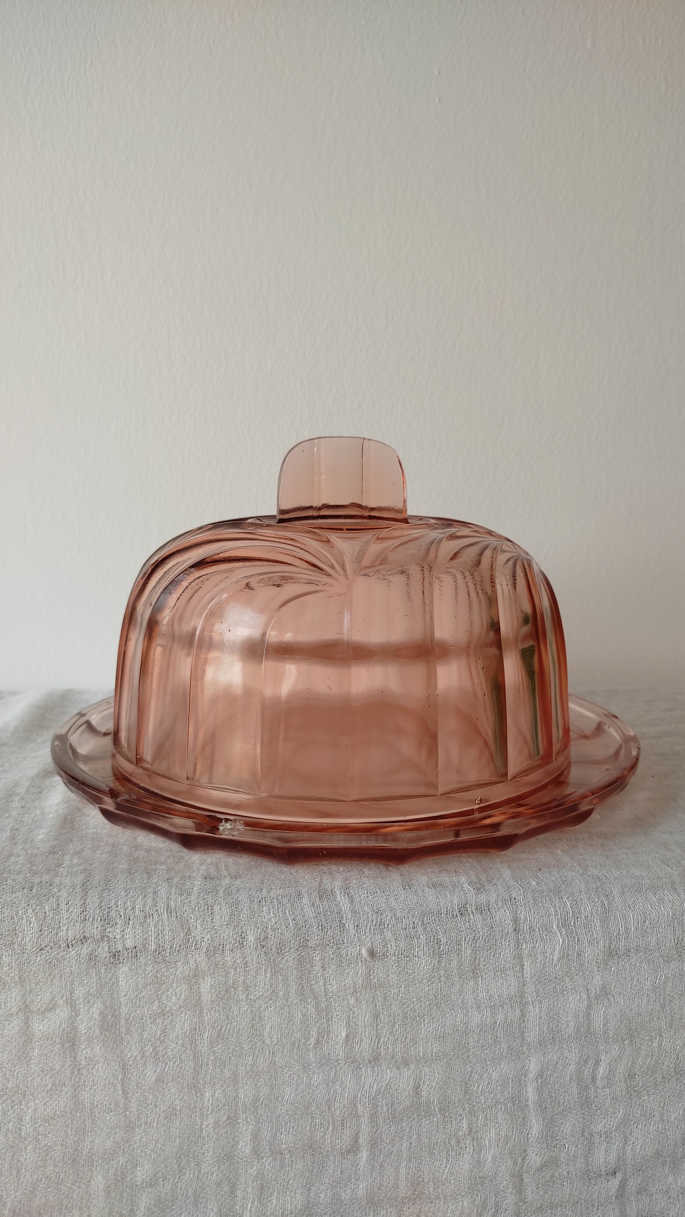 Old cheese or dessert bell and its pink art deco pressed glass tray