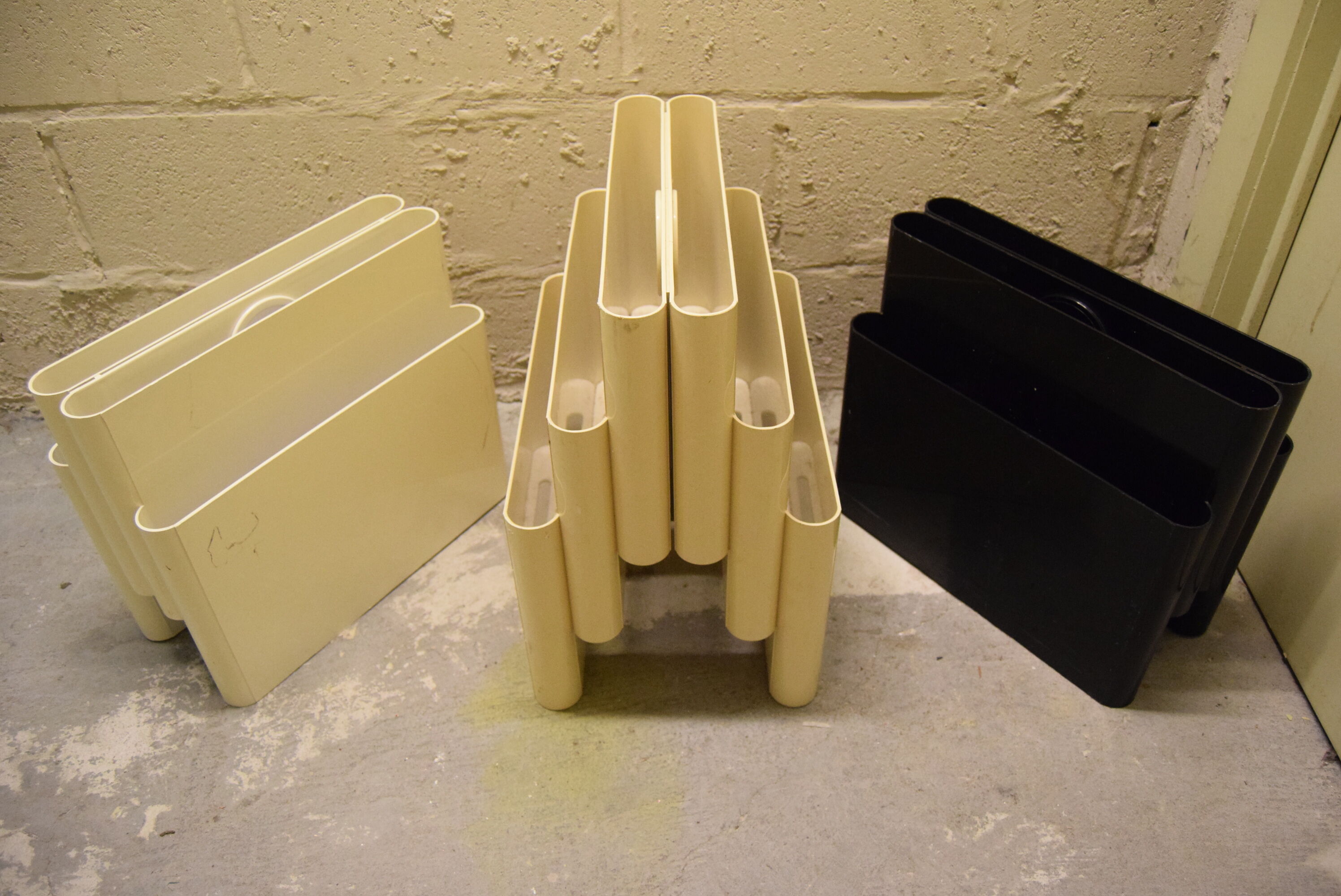 Kartell magazine holder by Giotto Stoppino