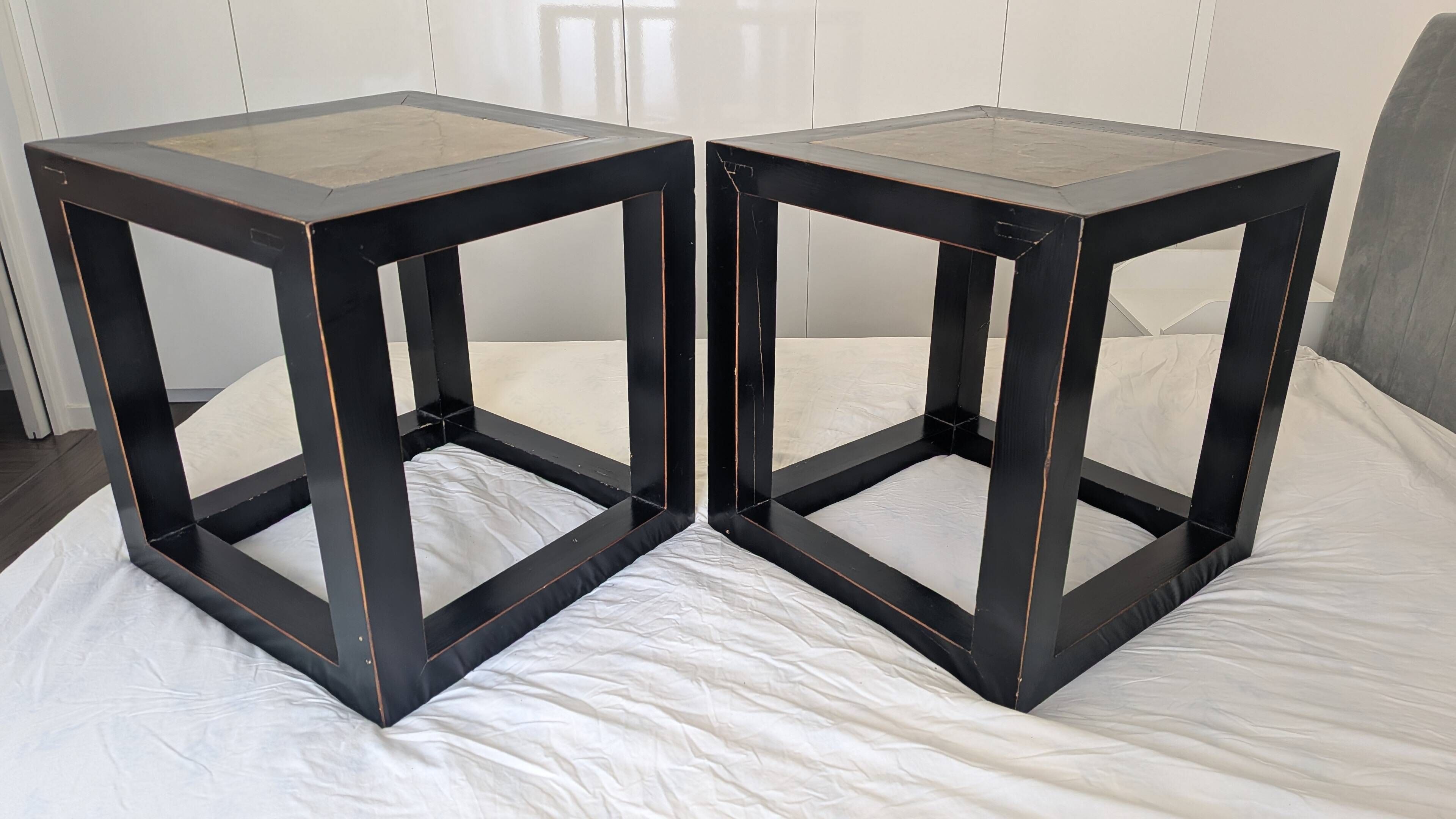 Chinese side tables in black lacquer, stone top.