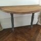 Antique painted wooden half-moon console table