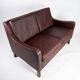 Two seater sofa, with red brown leather by Stouby Furniture